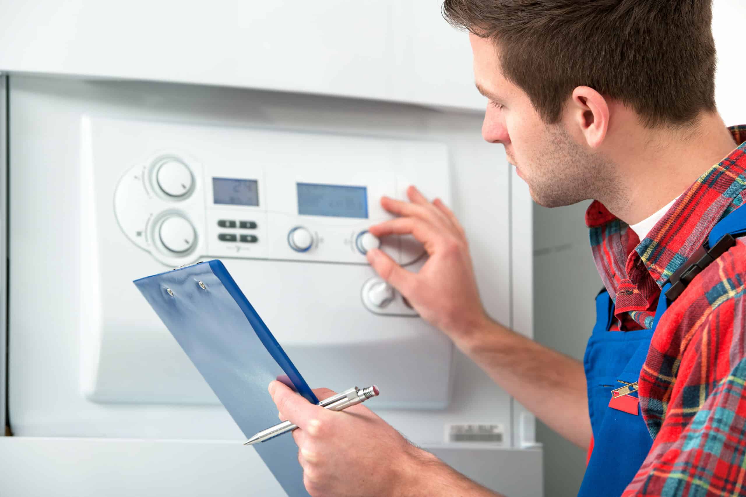 tech looking at ac unit