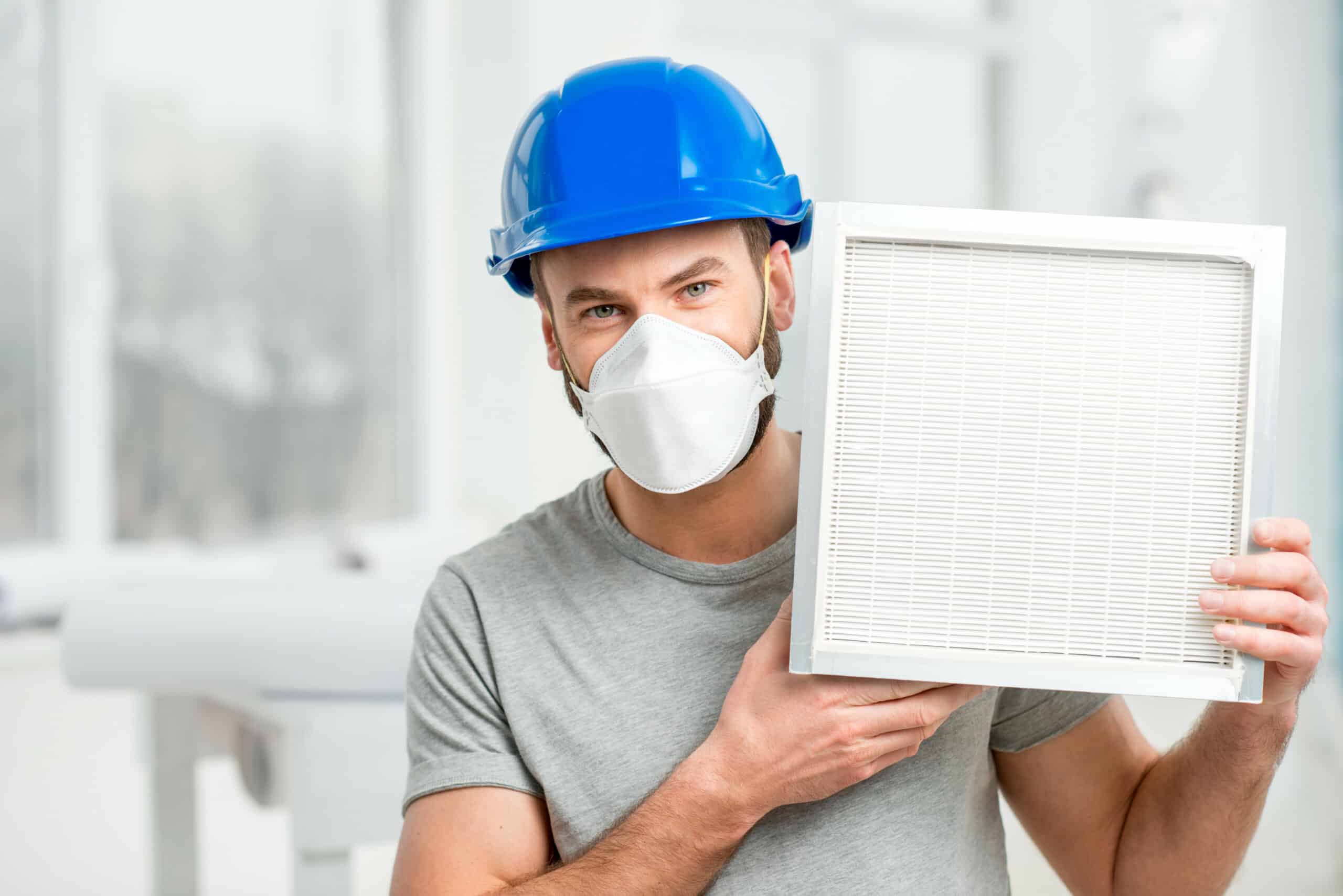man holding air filter