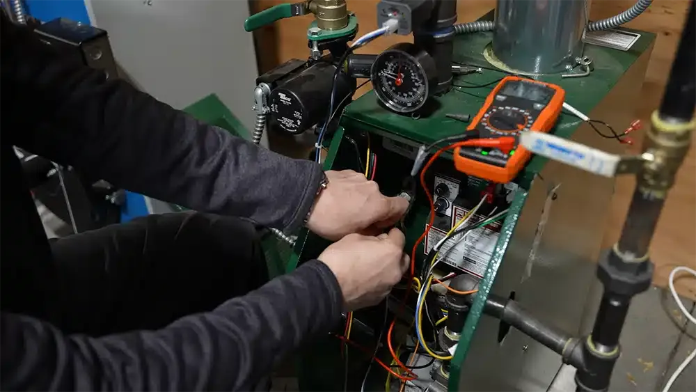 Martel specialist servicing HVAC unit