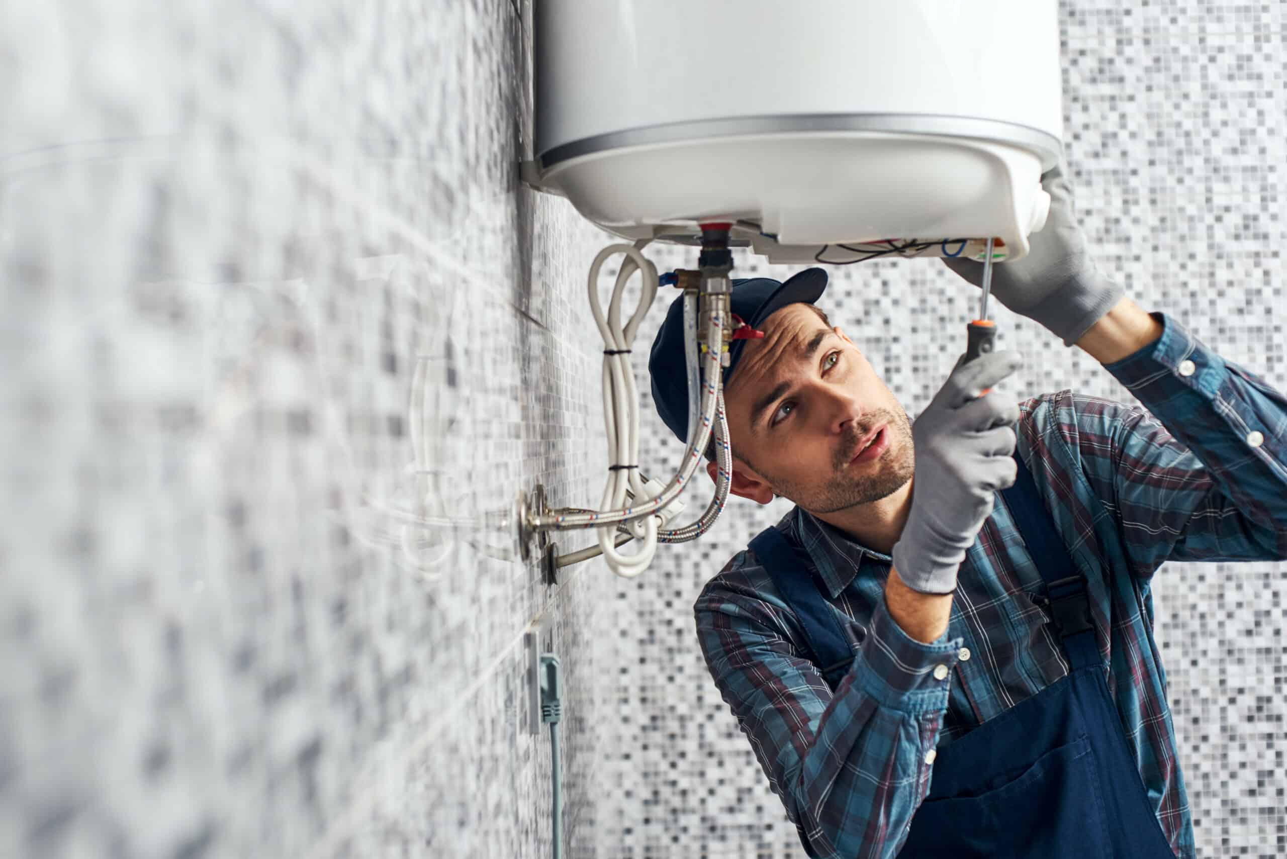 service tech working on boiler