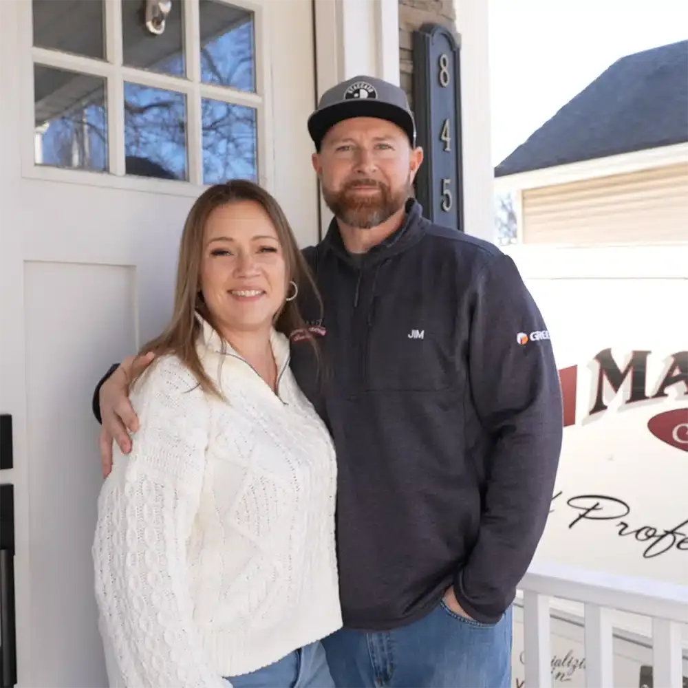 Martel owner smiling with customer.