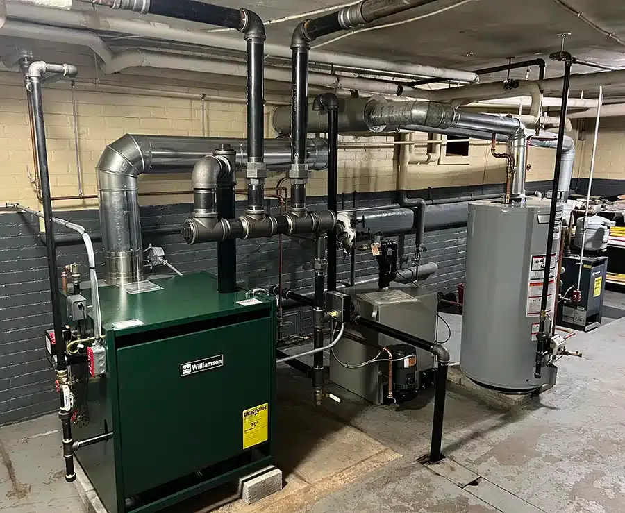 Commercial Williamson gas boiler and water heater installation in a Providence, RI multi-unit building by Martel