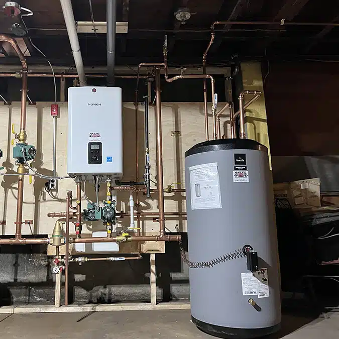 Navien wall-hung combination boiler and indirect water heater with copper piping, installed by Martel in Rhode Island